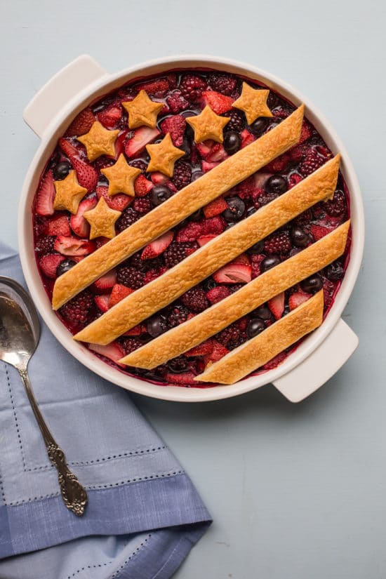 Patriotic Berry Cobbler decorated with a crust of stars and stripes.