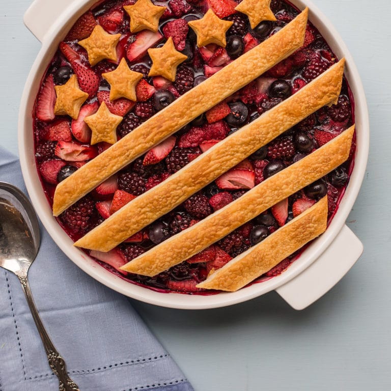 Patriotic Berry Cobbler decorated with a crust of stars and stripes.