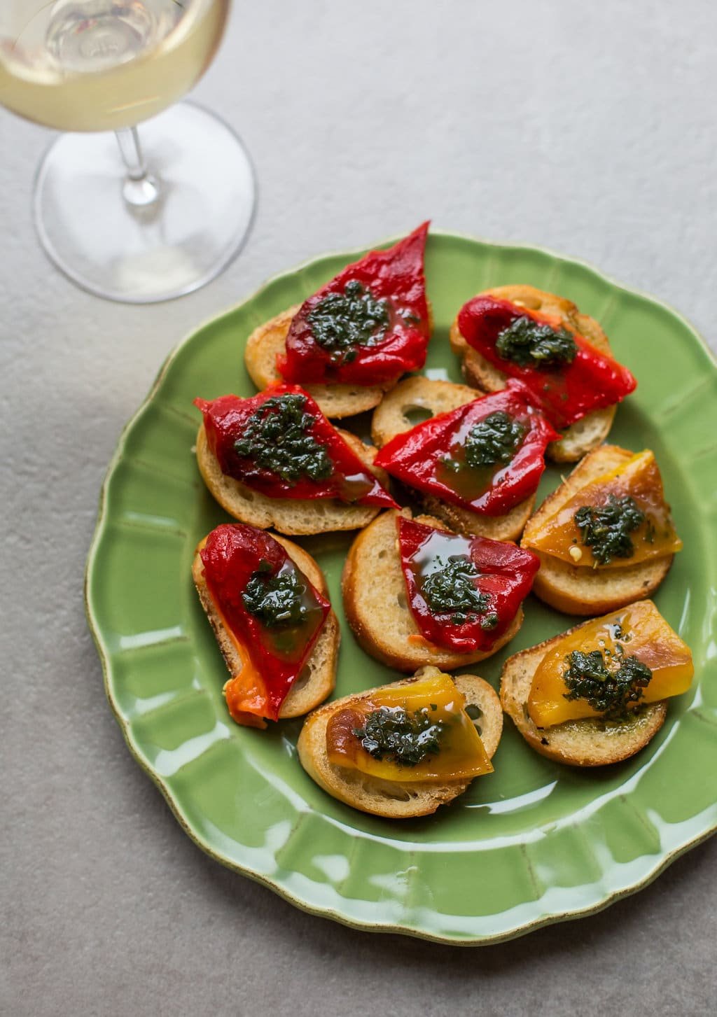 Roasted Pepper Crostini with Basil Oil on a plate/ Sarah Crowder 