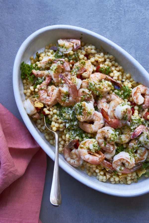 Couscous Salad with Shrimp, in a serving bowl with a spoon