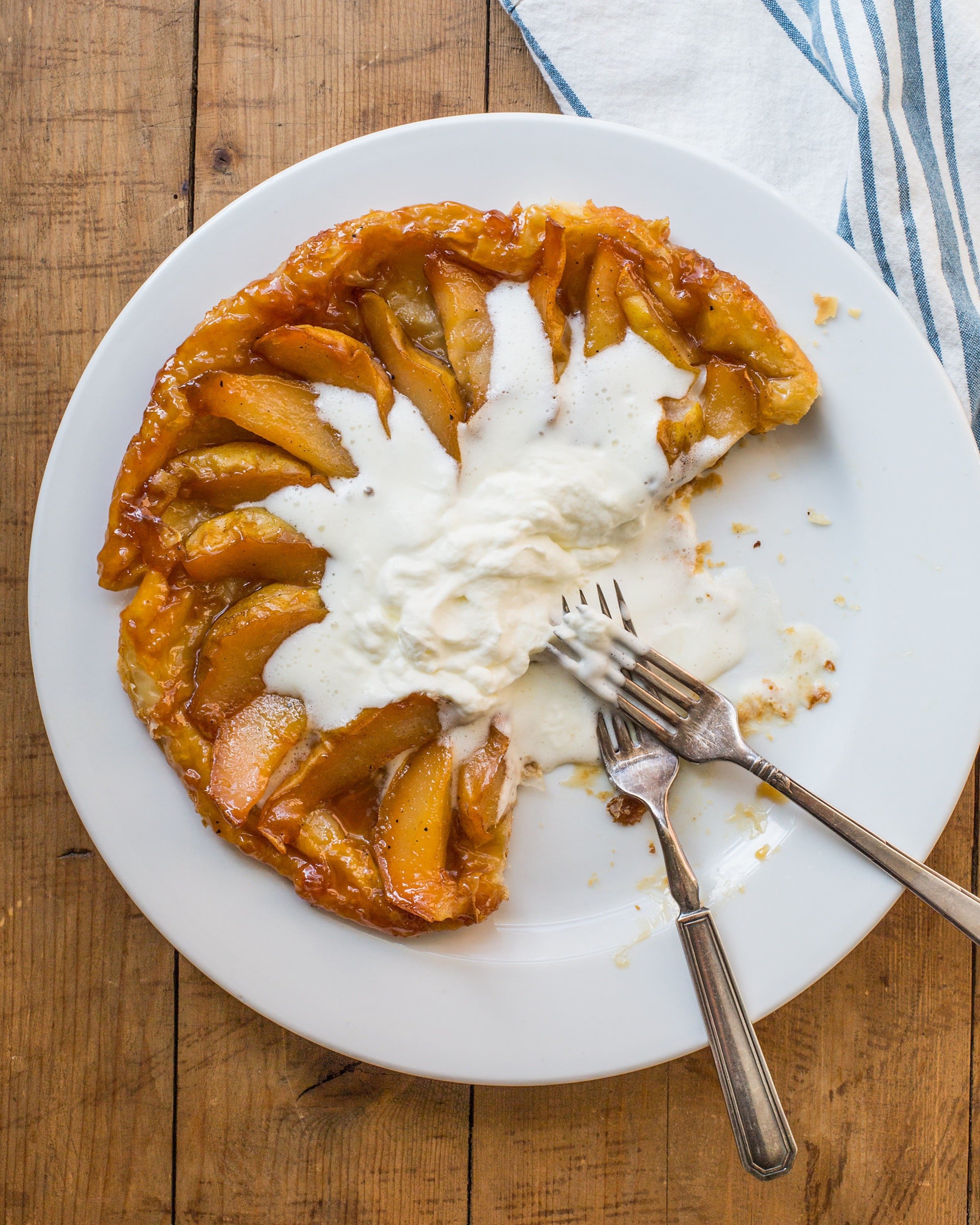 Pear Tartin Tatin with two forks on a plate.