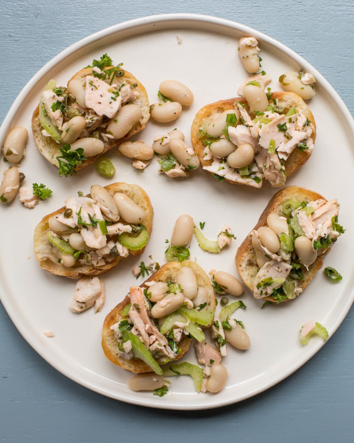 Five Salmon and White Bean Bruschetta on a plate.