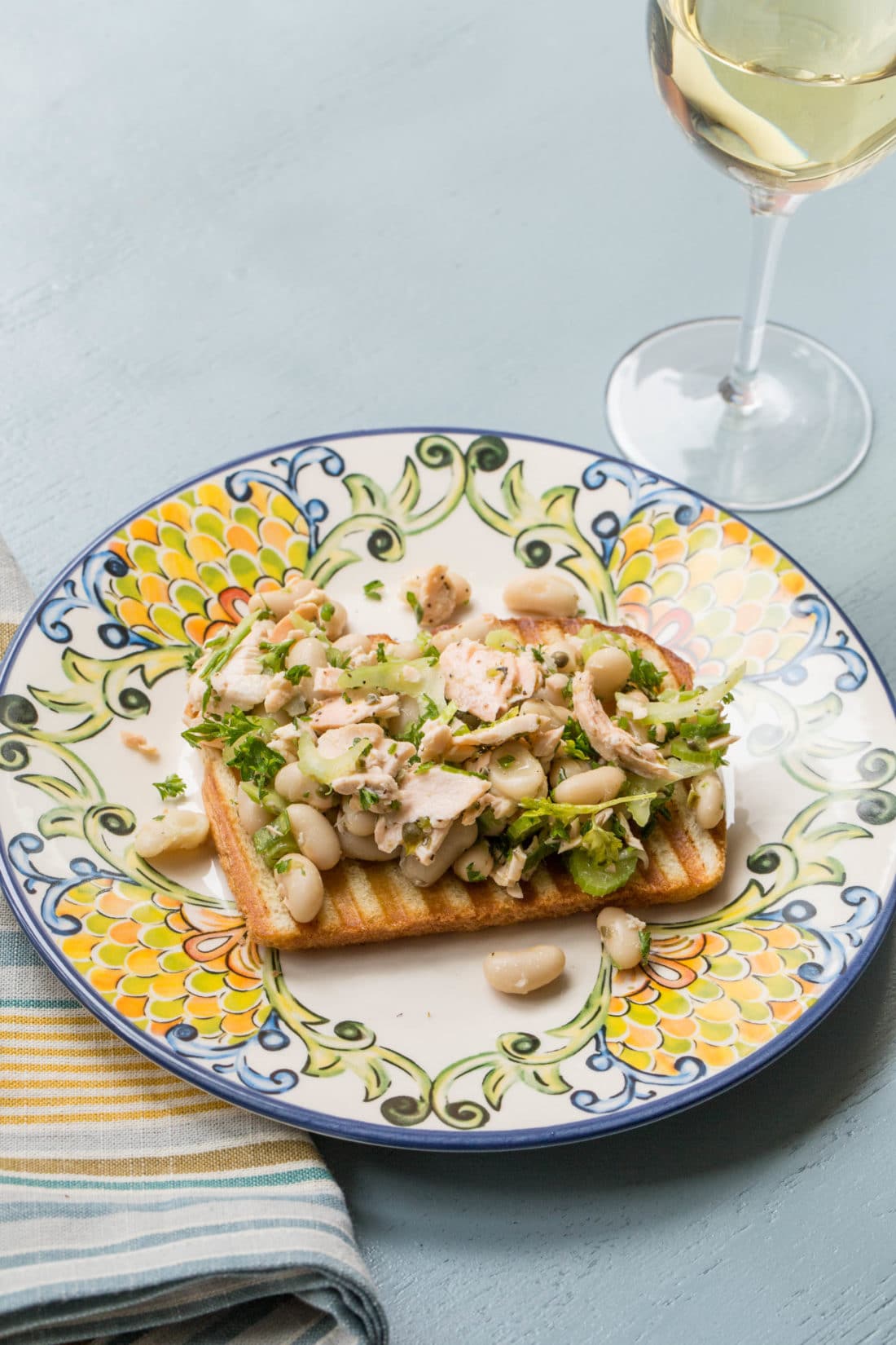 Salmon and White Bean Bruschetta on a colorful plate.