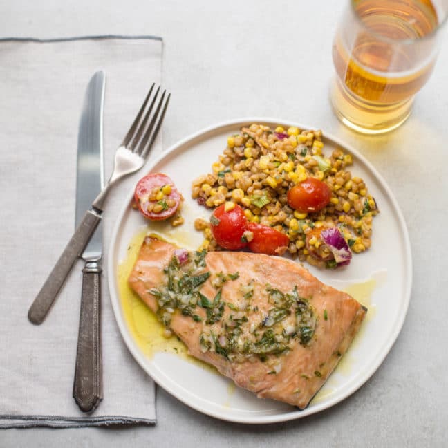 White plate of grain salad and Salmon with Tarragon Vinaigrette.