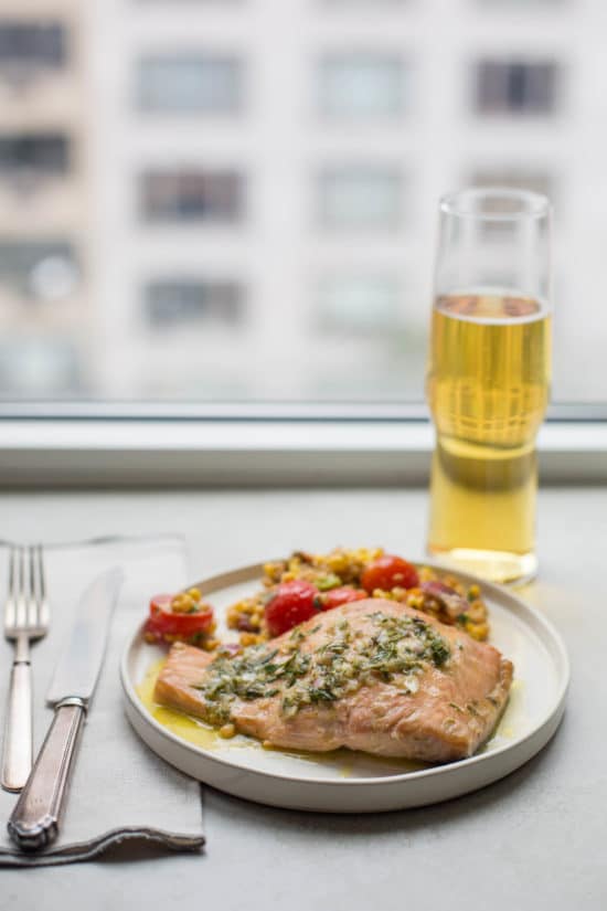 Grain salad and Salmon with Tarragon Vinaigrette on a plate.