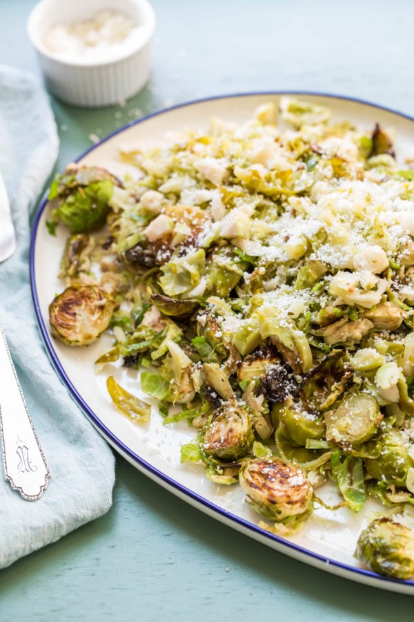 Brussels Sprouts Three Ways on a blue-rimmed plate.