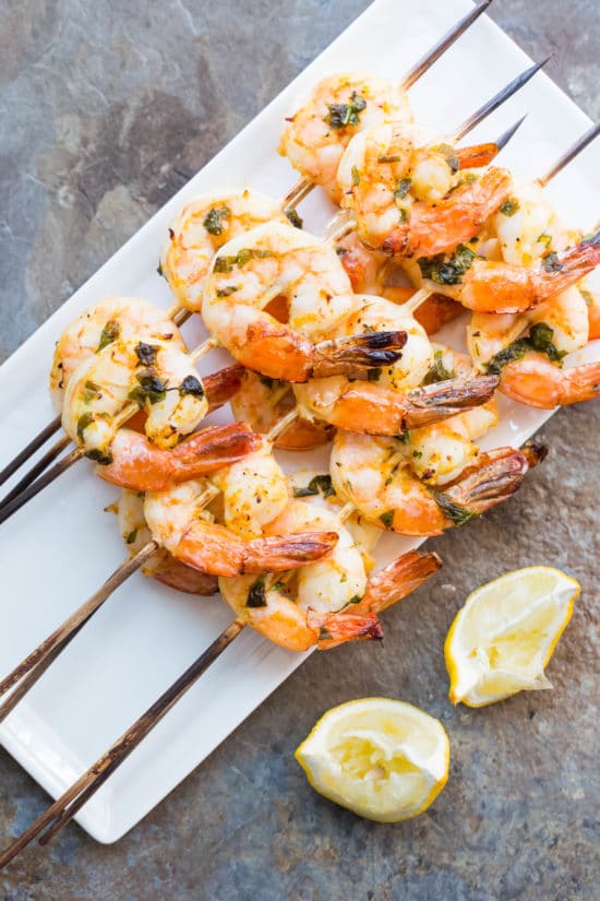 Citrus Basil Shrimp Kebabs on a white plate.