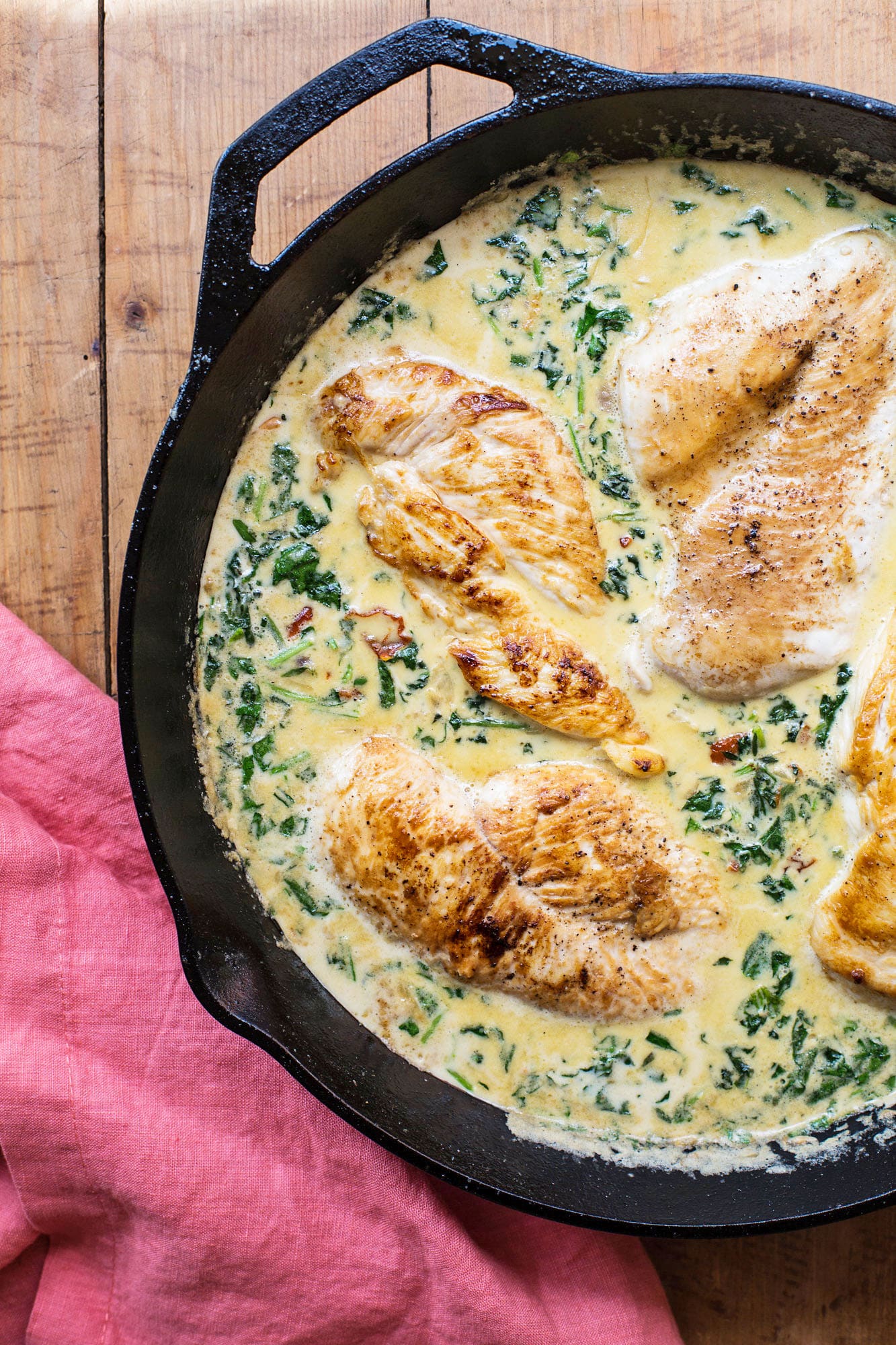 Creamy Italian Chicken in large skillet on table.