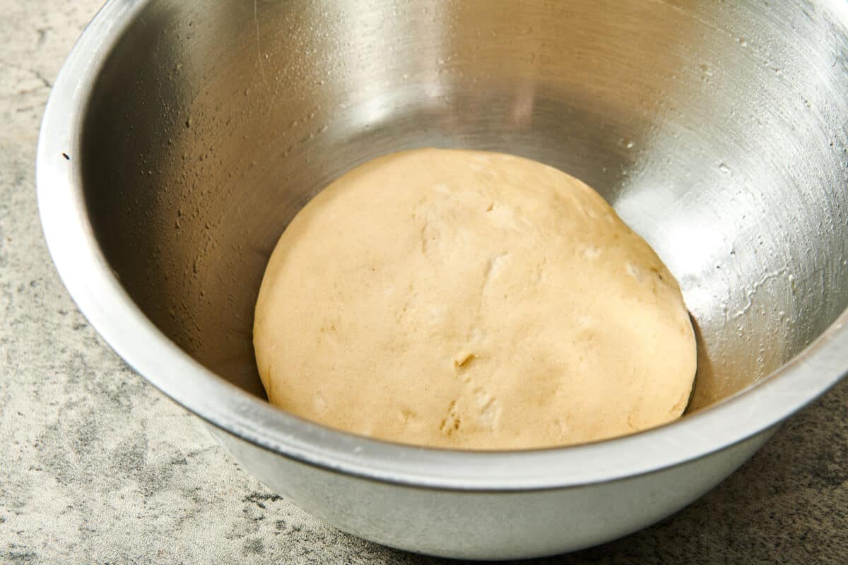 Pizza Dough in a metal bowl.