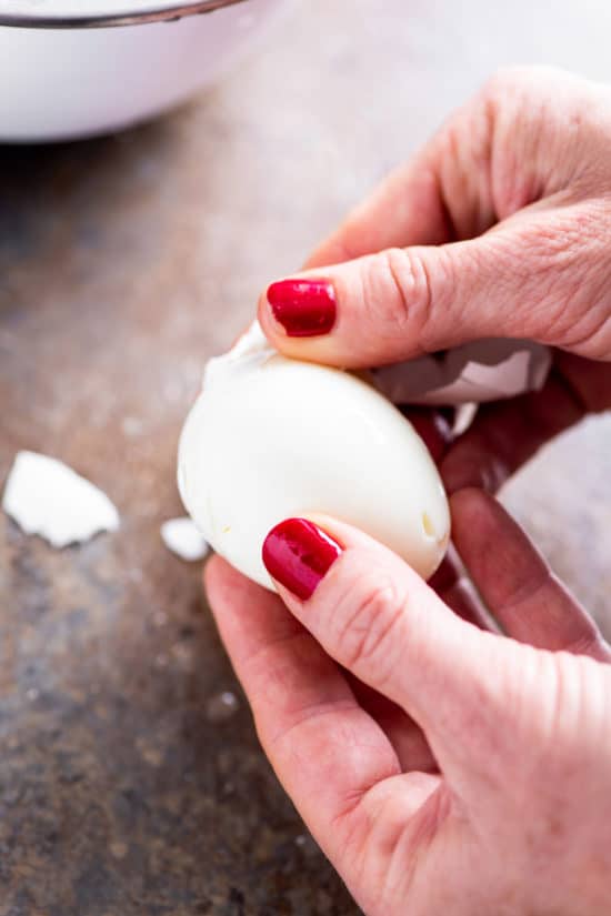 How do you peel hard boiled eggs?