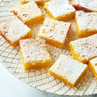Lemon Squares on a decorated plate.