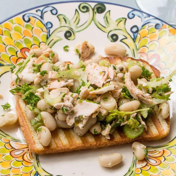 Salmon and White Bean Bruschetta on a colorful plate.