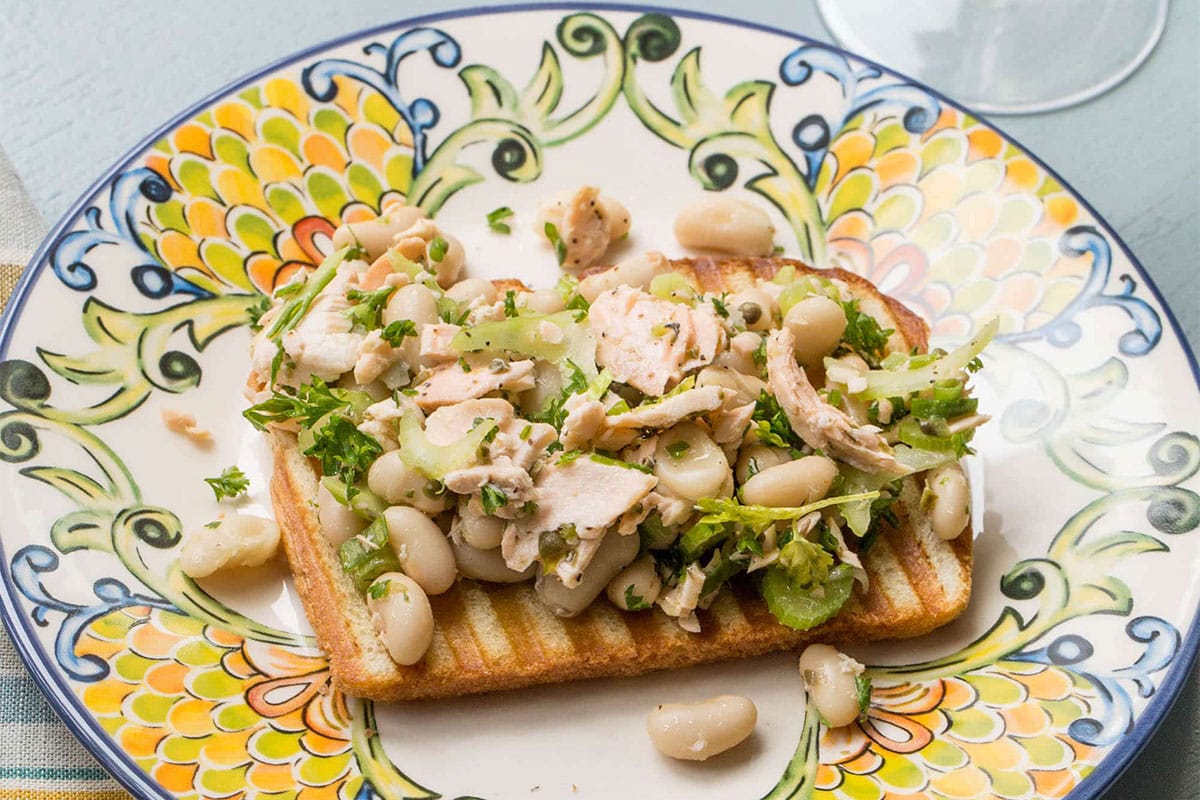 Salmon and White Bean Bruschetta on a colorful plate.