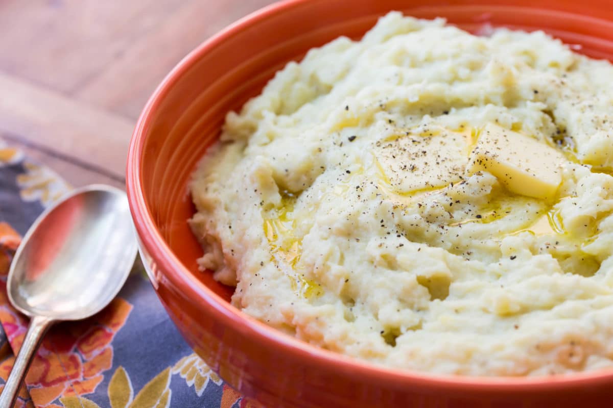 Cheesy Mashed Potatoes in a red bowl.