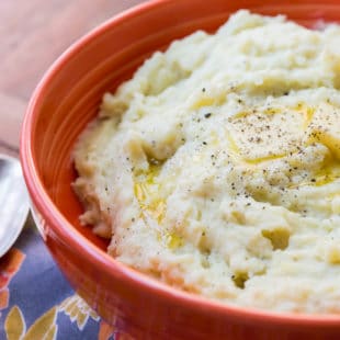 Cheesy Mashed Potatoes in a red bowl.