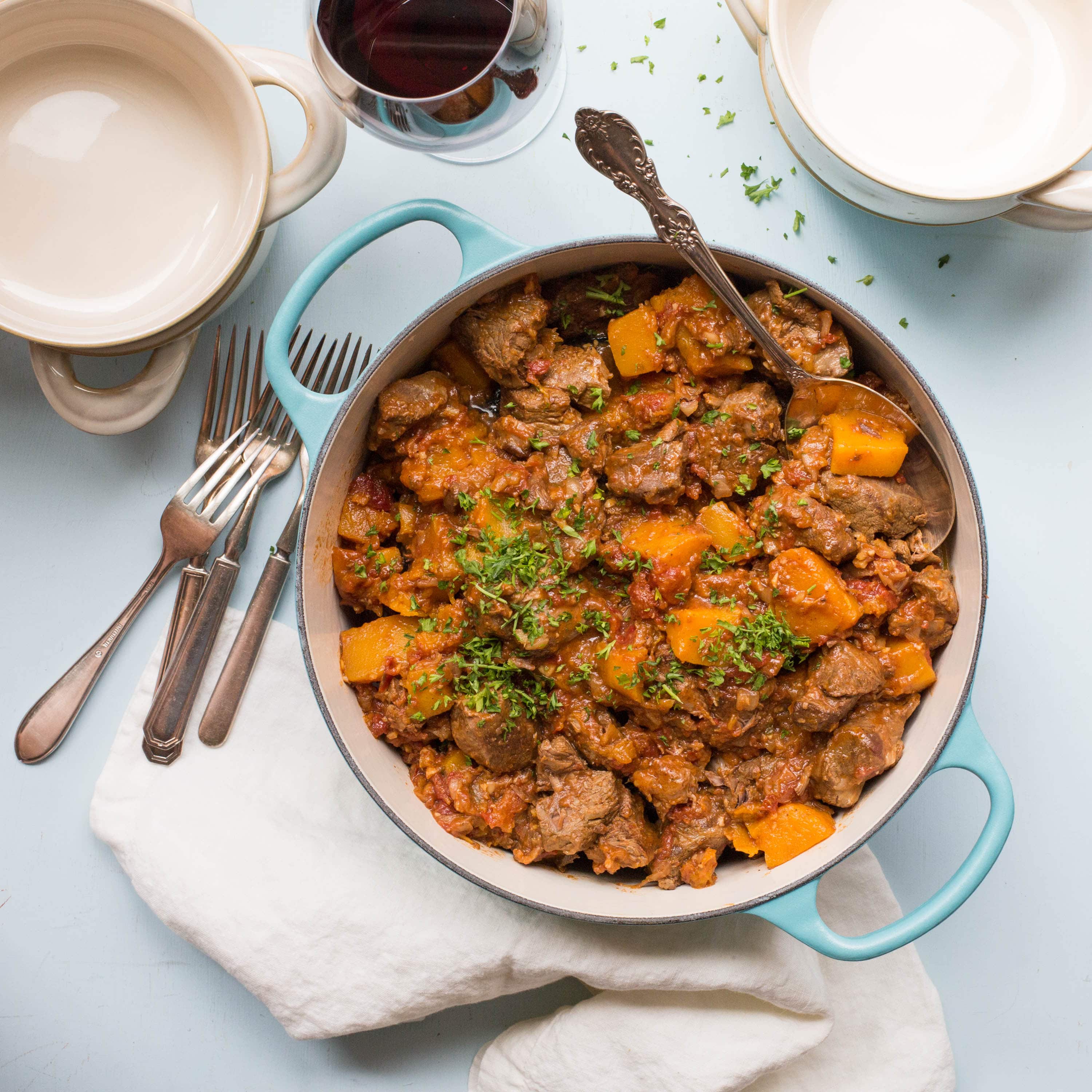 Moroccan Lamb and Butternut Squash Stew  in a blue pot.