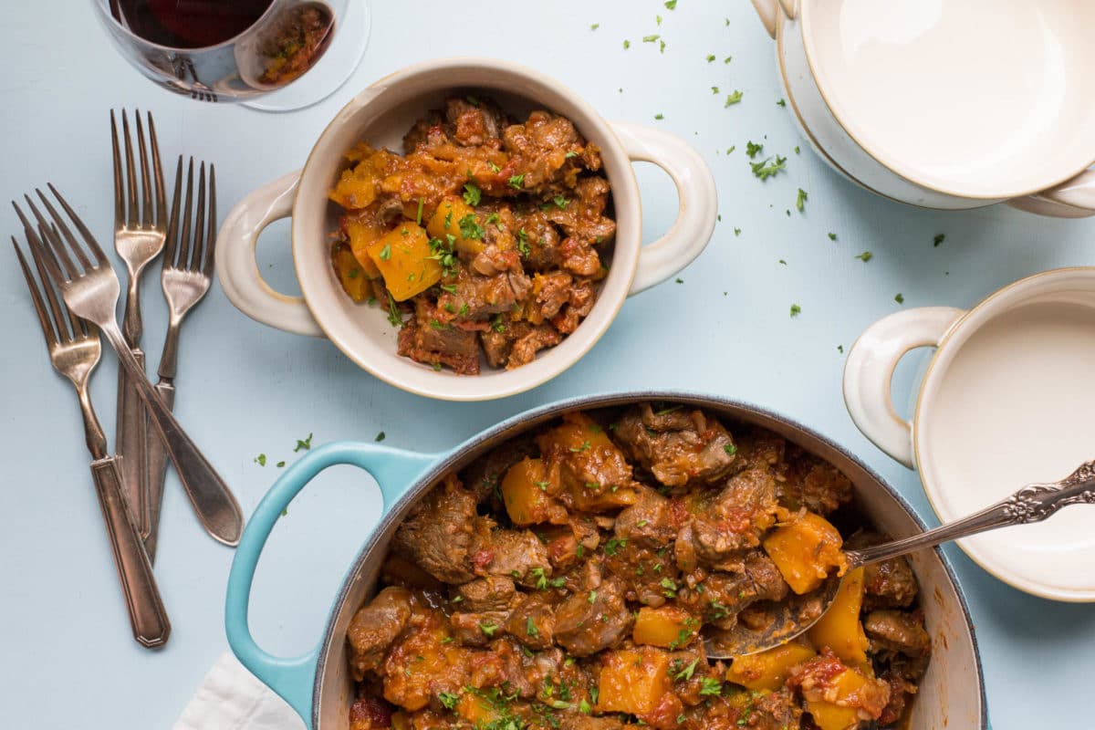 Moroccan Lamb and Butternut Squash Stew in a pot and a bowl.