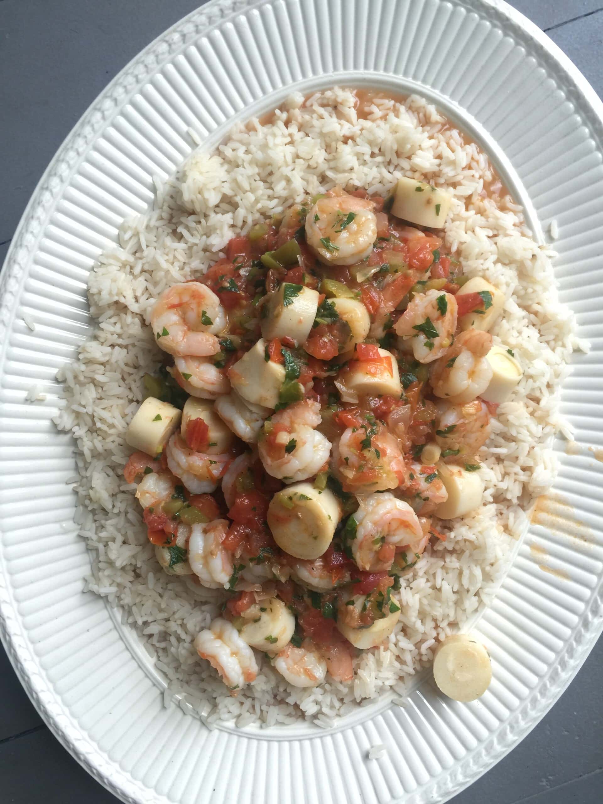 Hearts of palm and shrimp over a bed of rice.