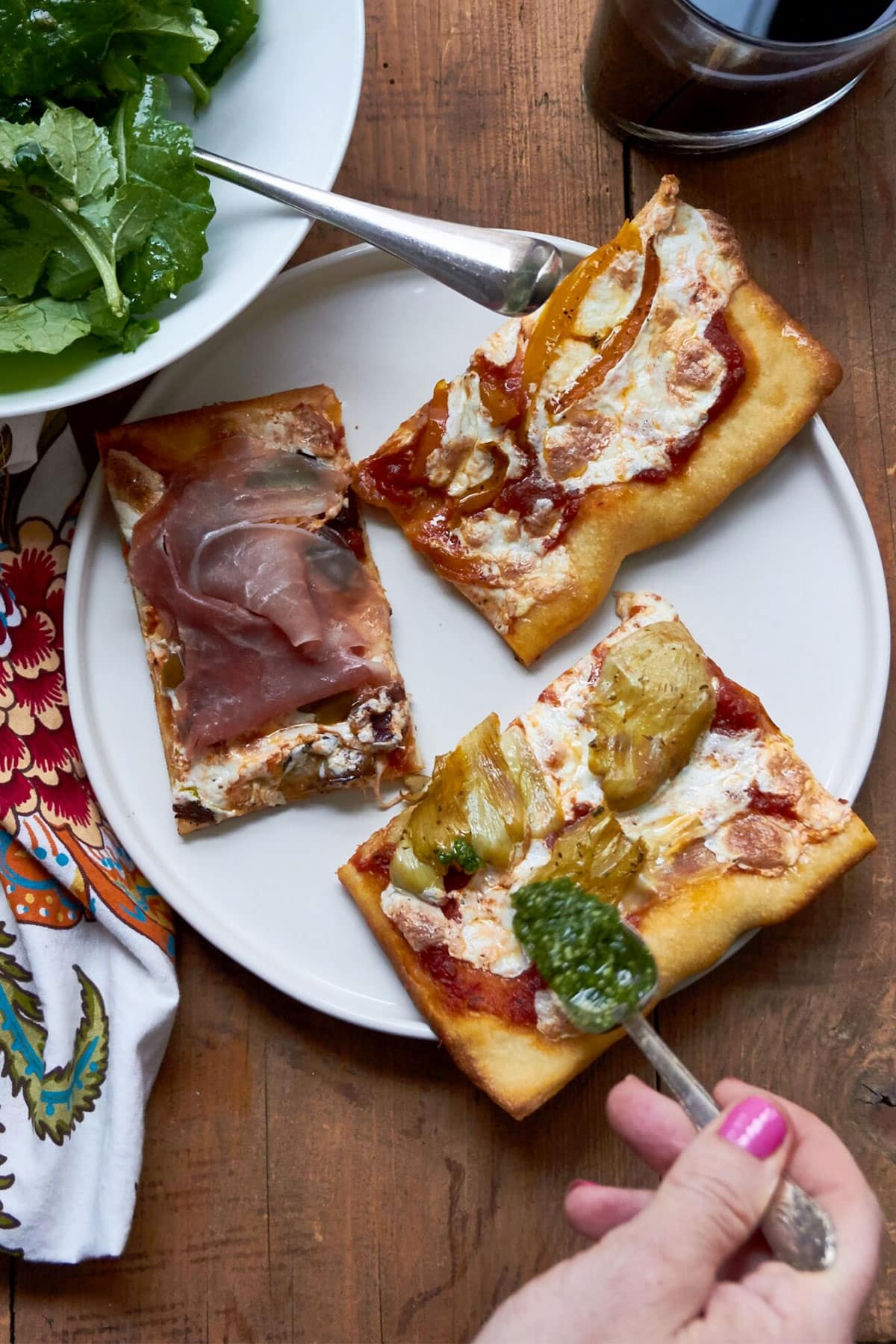 Three slices of Pizza Quattro Stagioni on a plate.