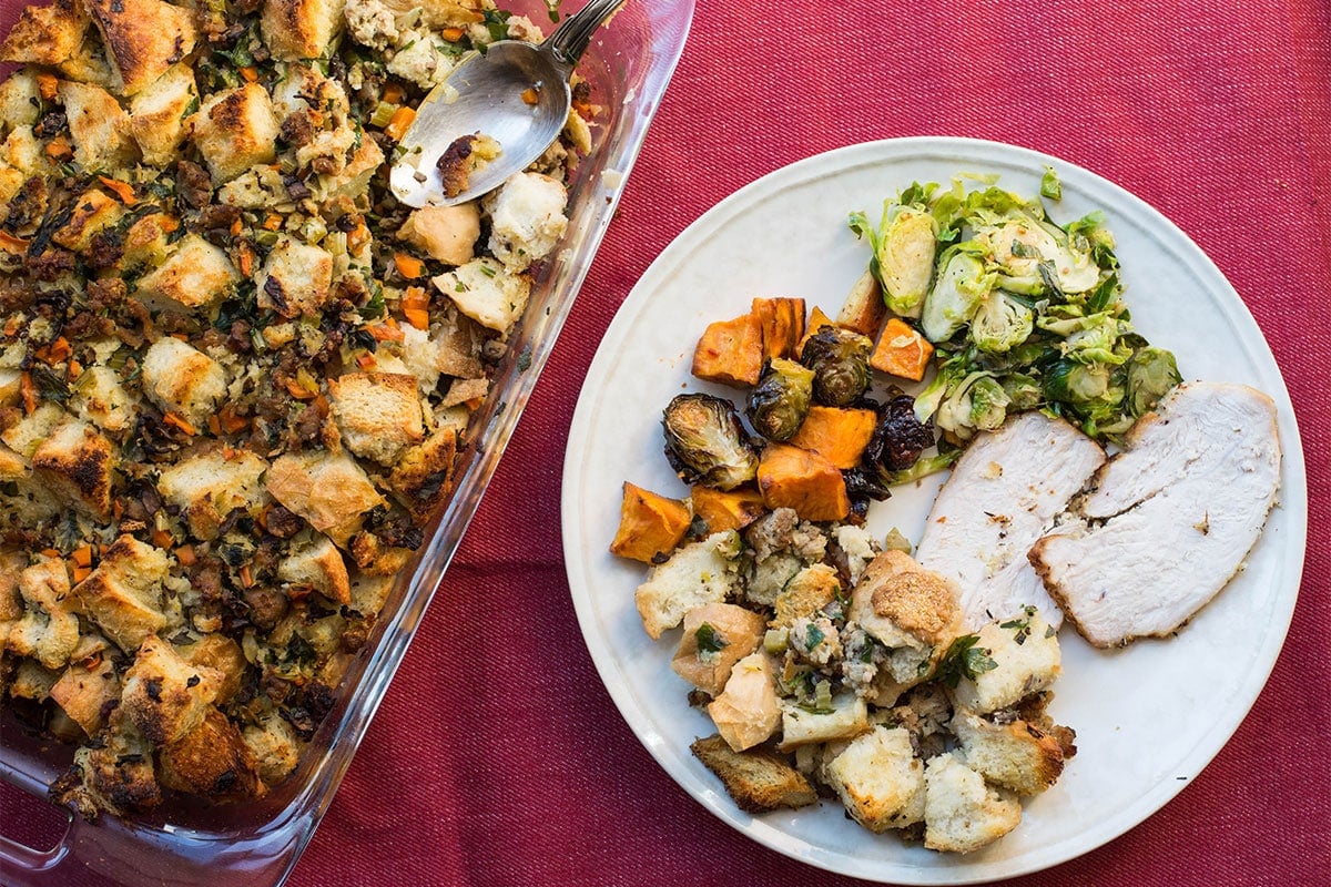 Thanksgiving Plate with Bread Stuffing and sliced turkey.