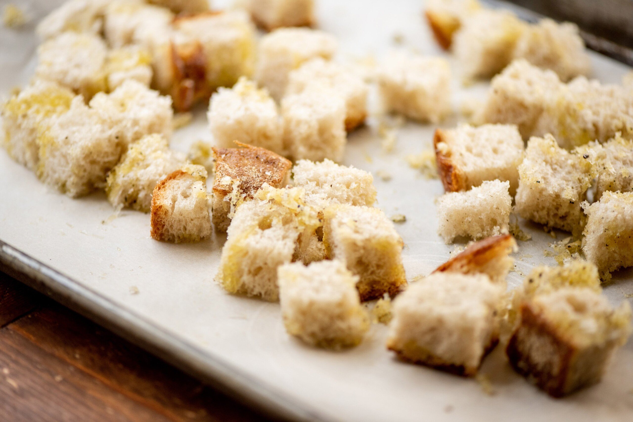 Parmesan Croutons on white plate.