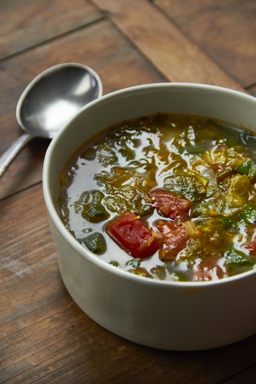 Escarole and Spinach Soup in a white bowl.