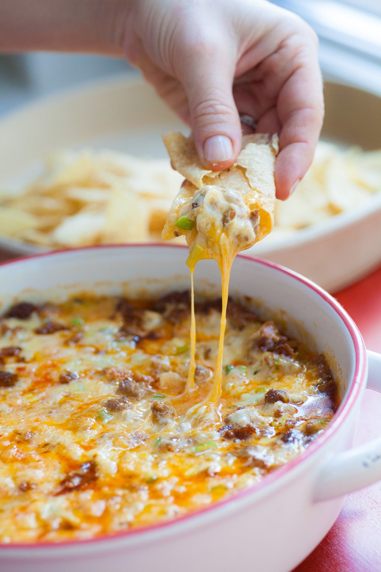 Chip of melted cheese from Queso Fundido with Chorizo.