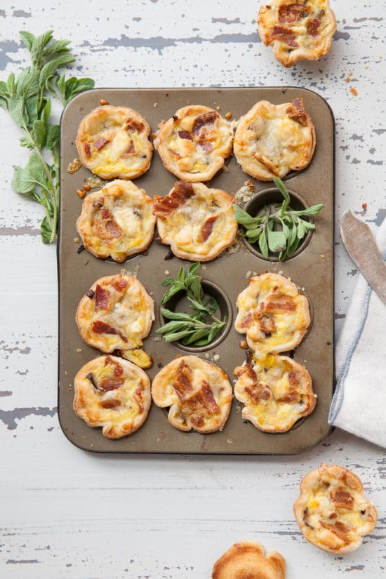 Bacon, Leek, Mushroom and Cheese Mini Quiches in a muffin tin.