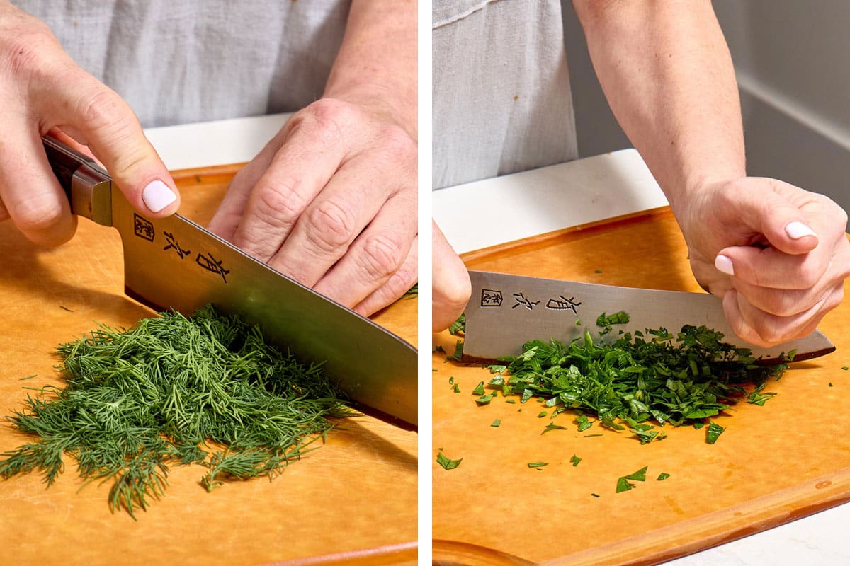 Woman chopping dill and parsley