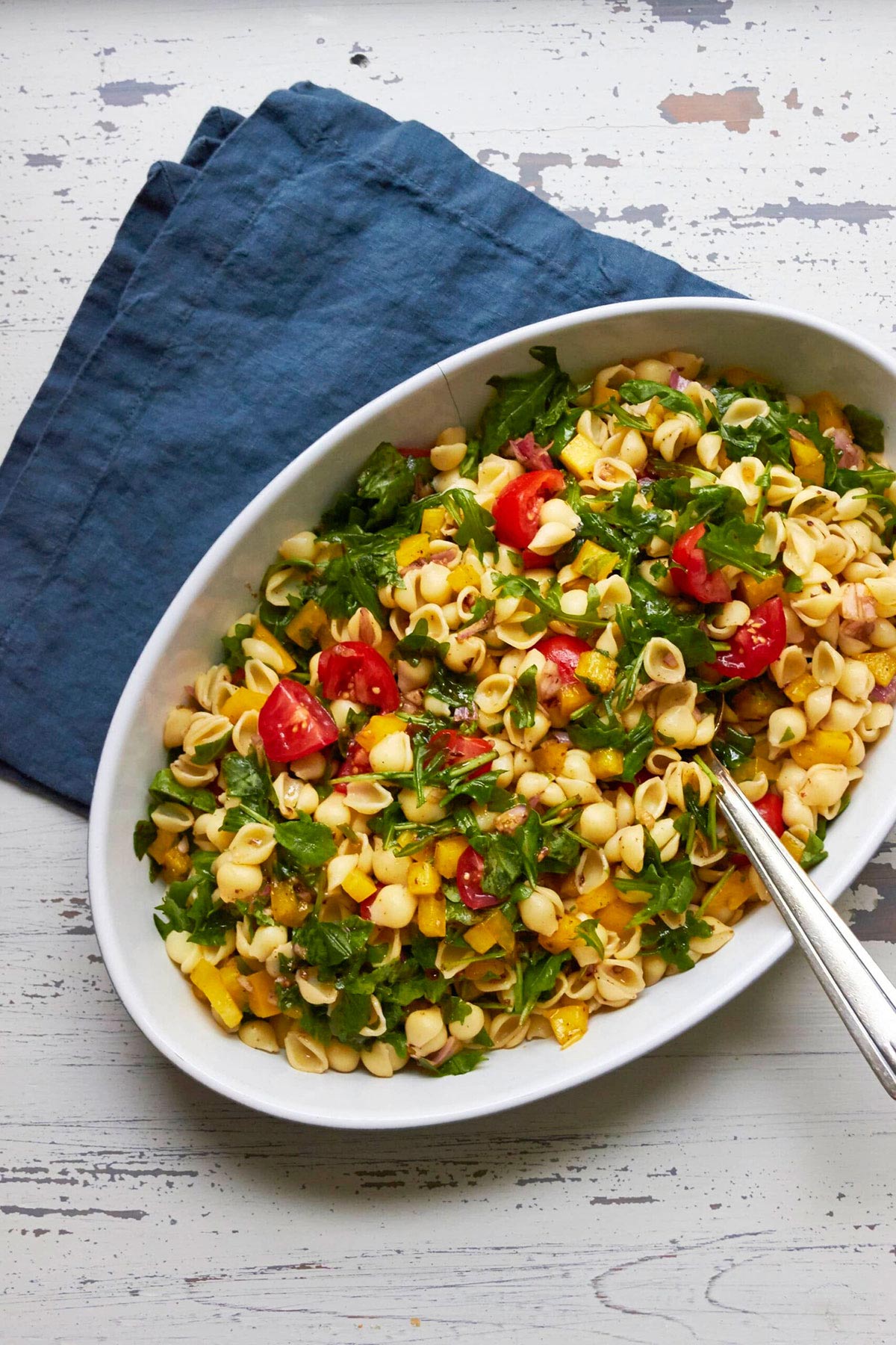 Spoon in a bowl of Mayo-Free Vegan Pasta Salad.