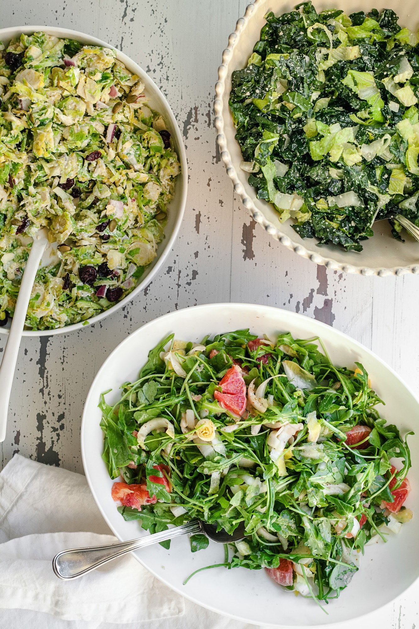 Endive Arugula and Orange Salad in bowls on table.