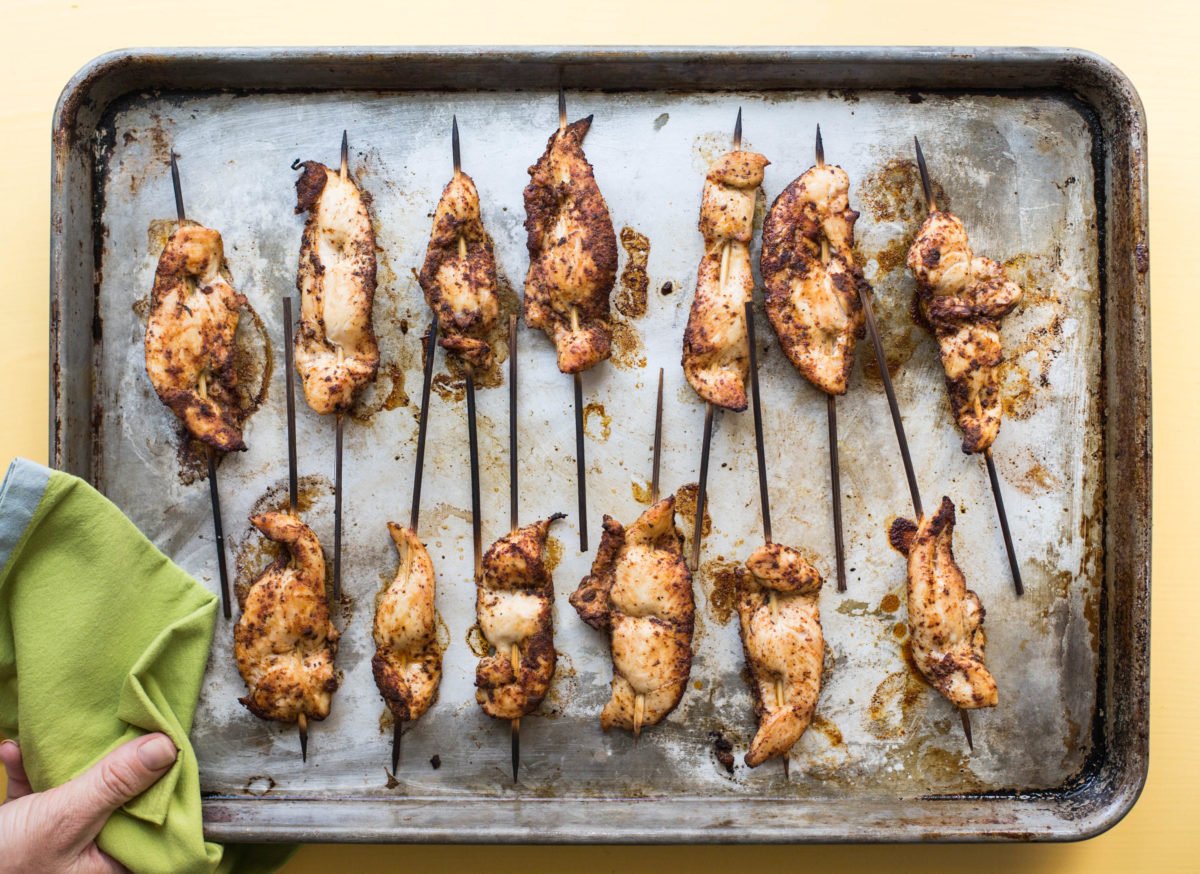 Chicken Tender Skewers with Spiced Curry Rub on a baking sheet.