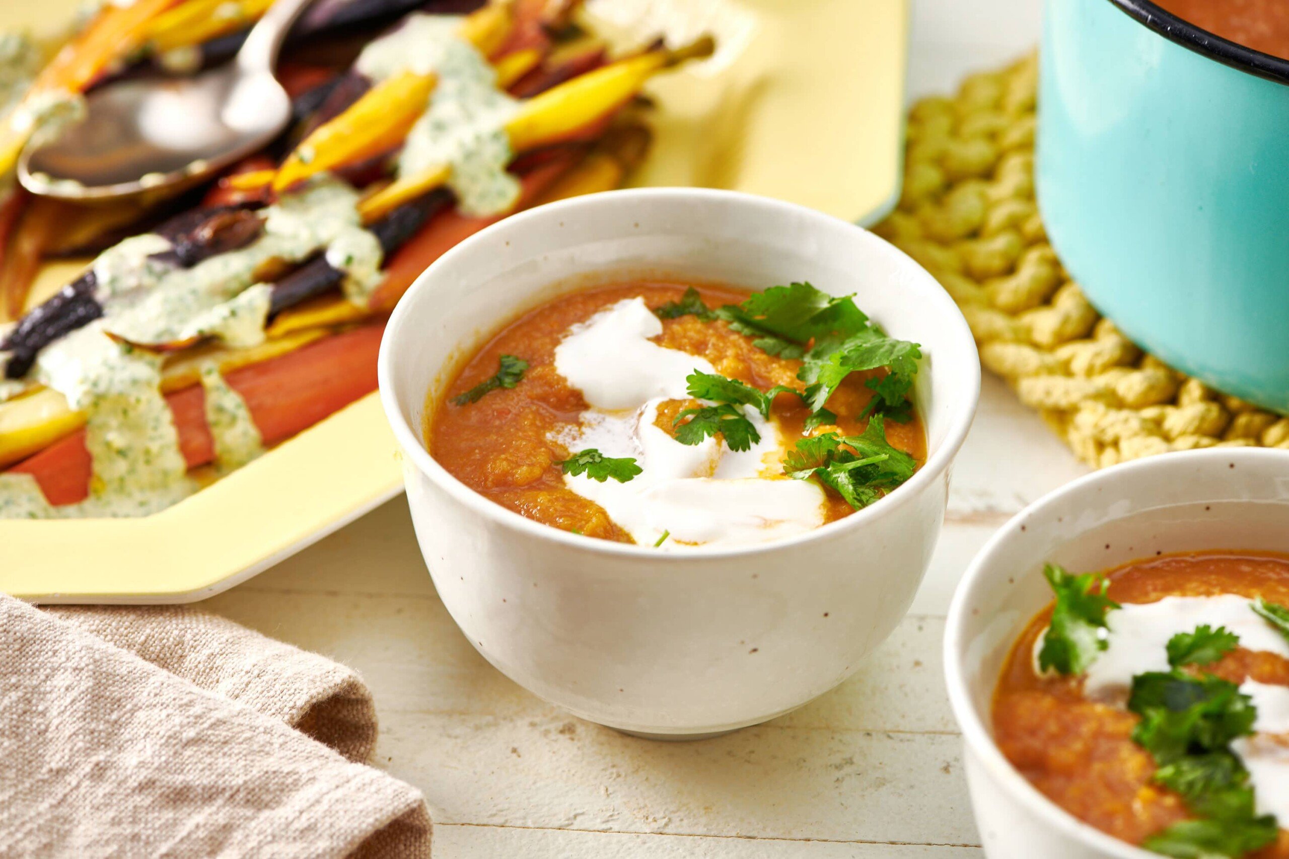 Moroccan Carrot and Cauliflower Soup in white bowl.