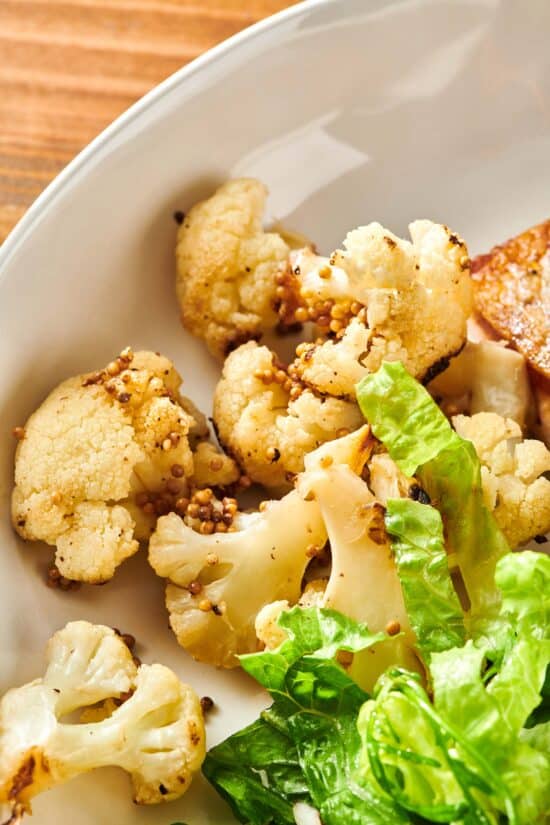 Sautéed Cauliflower with Mustard Seeds on a plate.