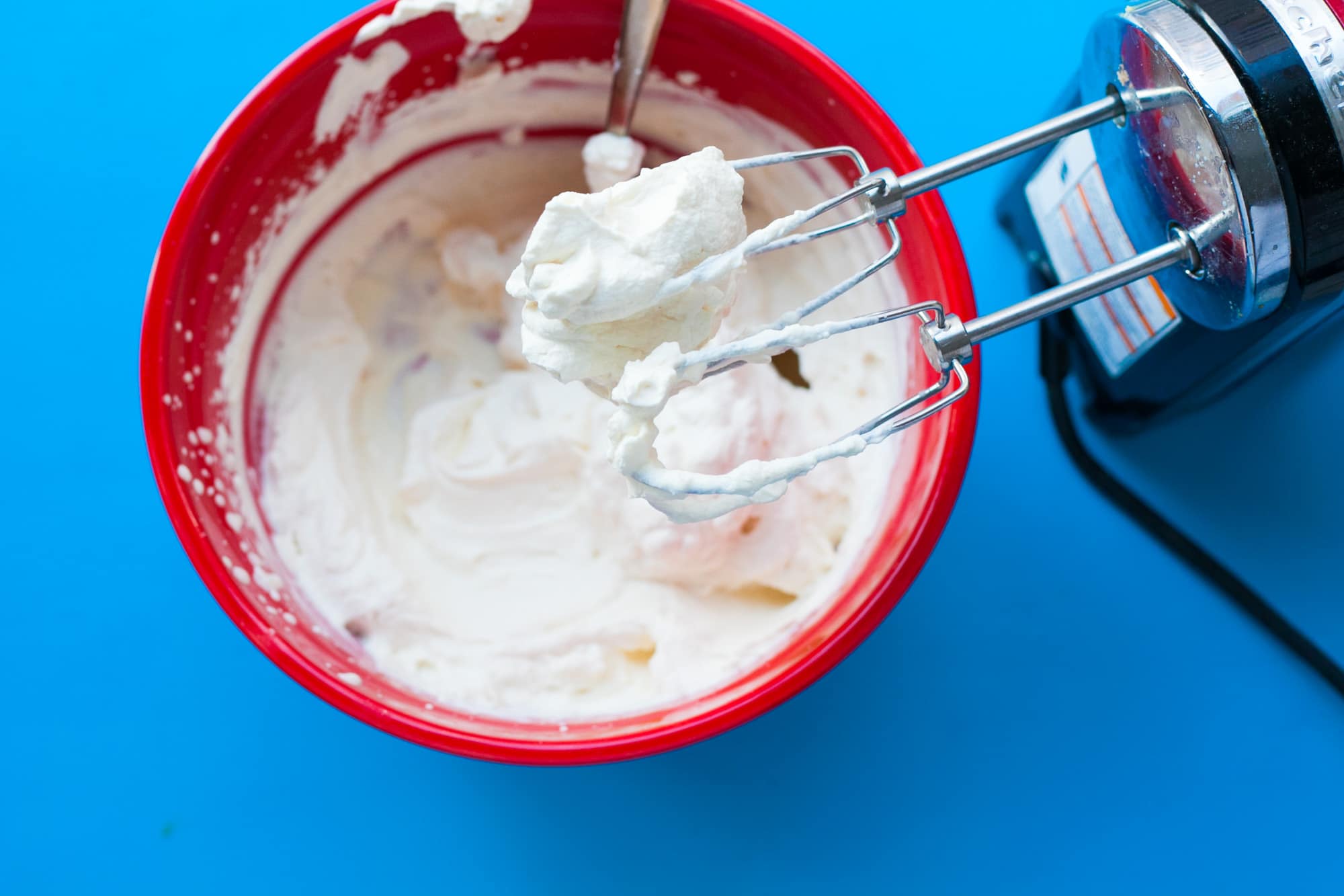 Making whipped cream with electric mixer.