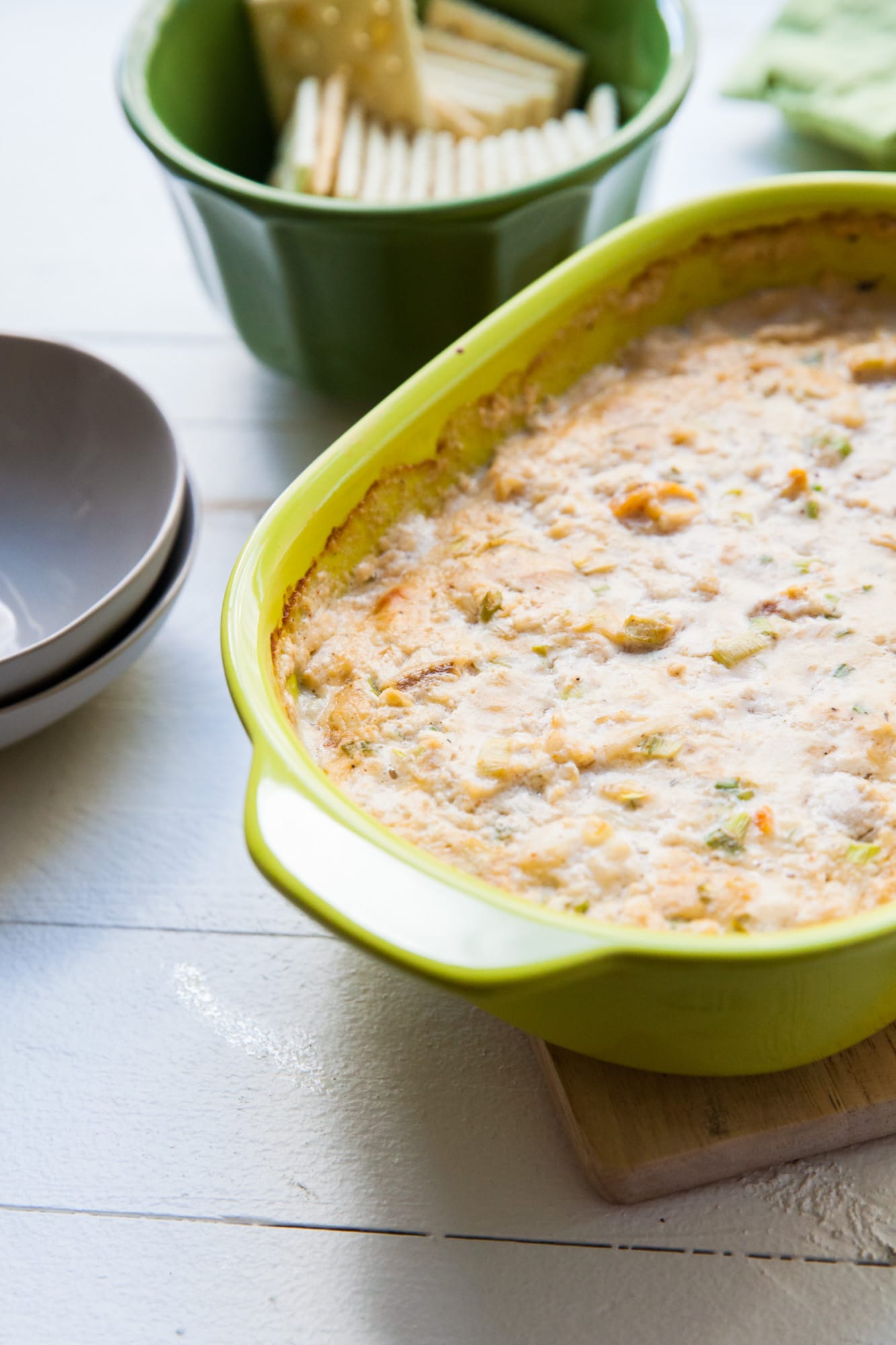 Hot crab dip in a yellow serving dish.