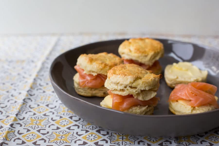 Irish scones with smoked salmon on a plate.