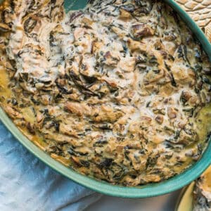 Hot Spinach and Goat Cheese Dip and crackers on table.