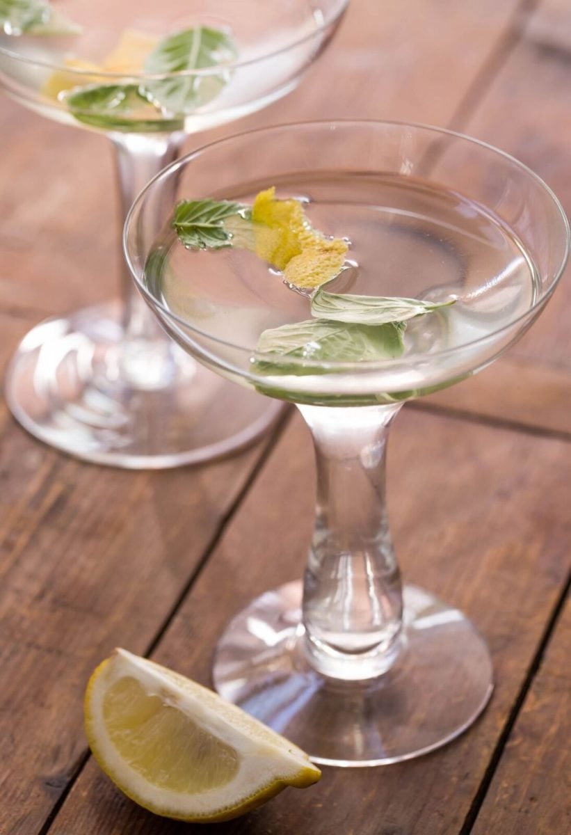 close up of lemon basil sake drink in a clear glass