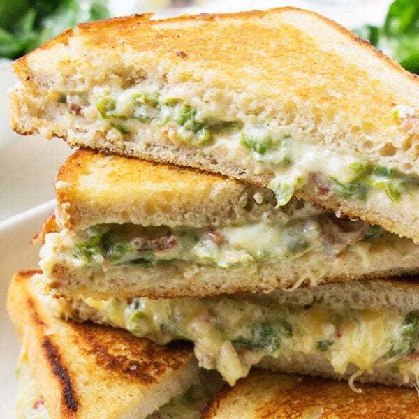 Jalapeno Popper Grilled Cheese stacked on plate.