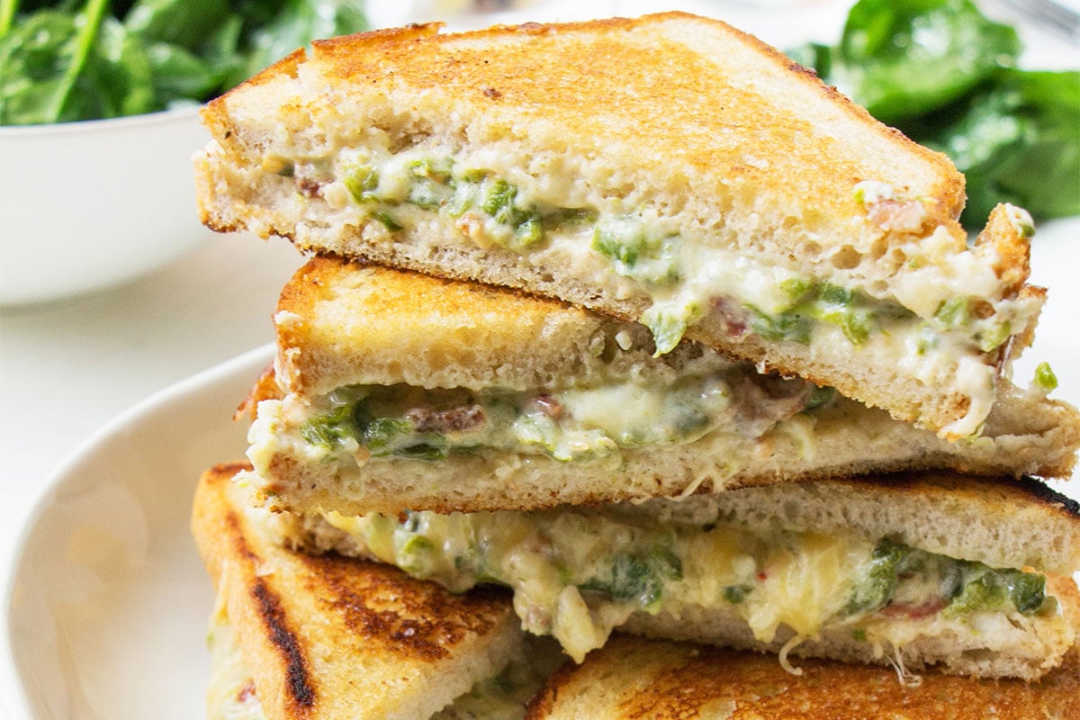 Jalapeno Popper Grilled Cheese stacked on plate.