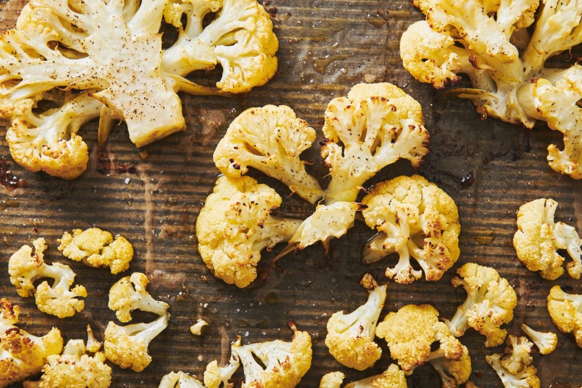 Roasted Cauliflower Steaks on a lined baking sheet.