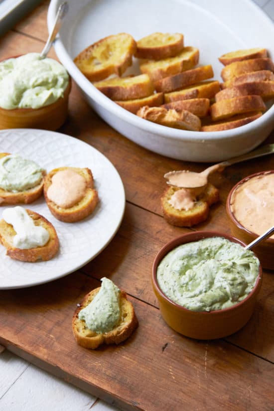 Bread topped with different flavors of whipped fresh ricotta.