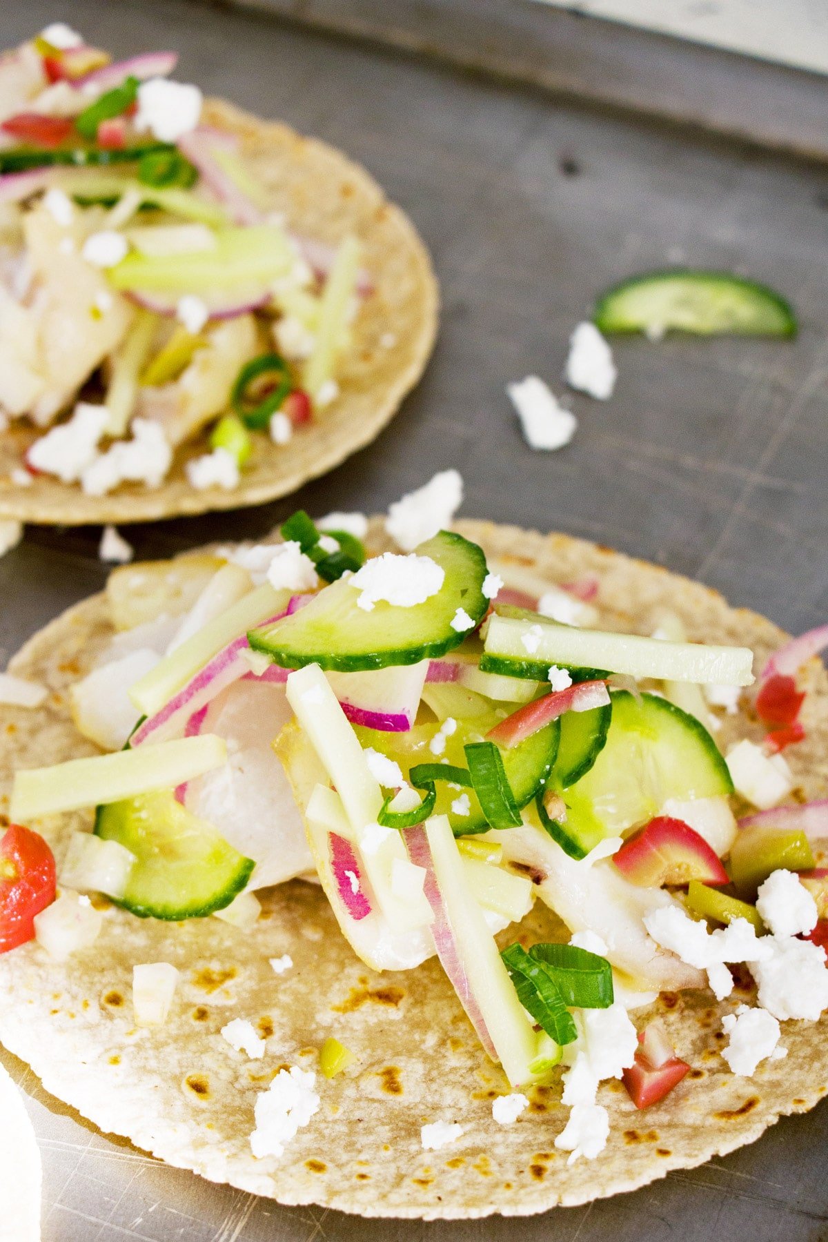 Vegetable slaw piled high on a Flaky Fish Tacos.