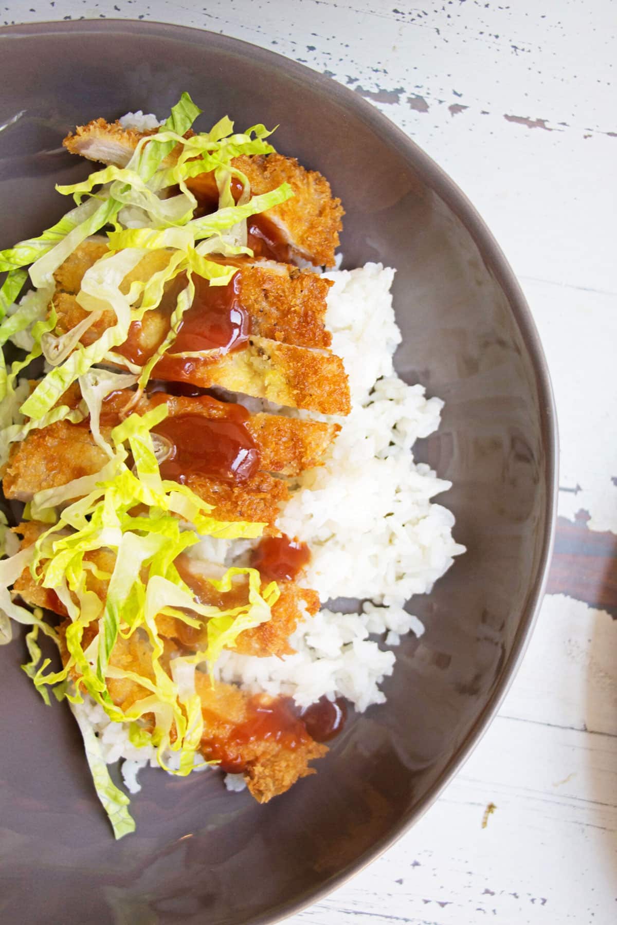 Slices of Chicken Katsu over rice.