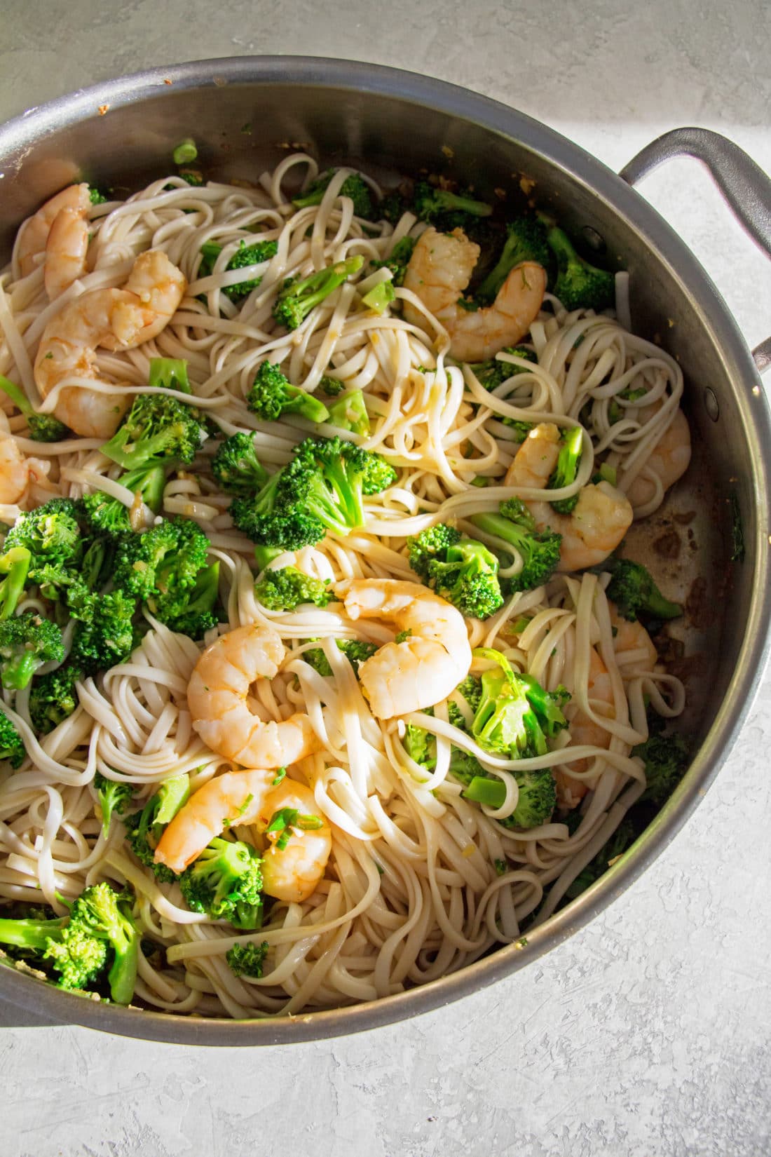 Pot of Shrimp and Broccoli Stir Fry with Udon Noodles.