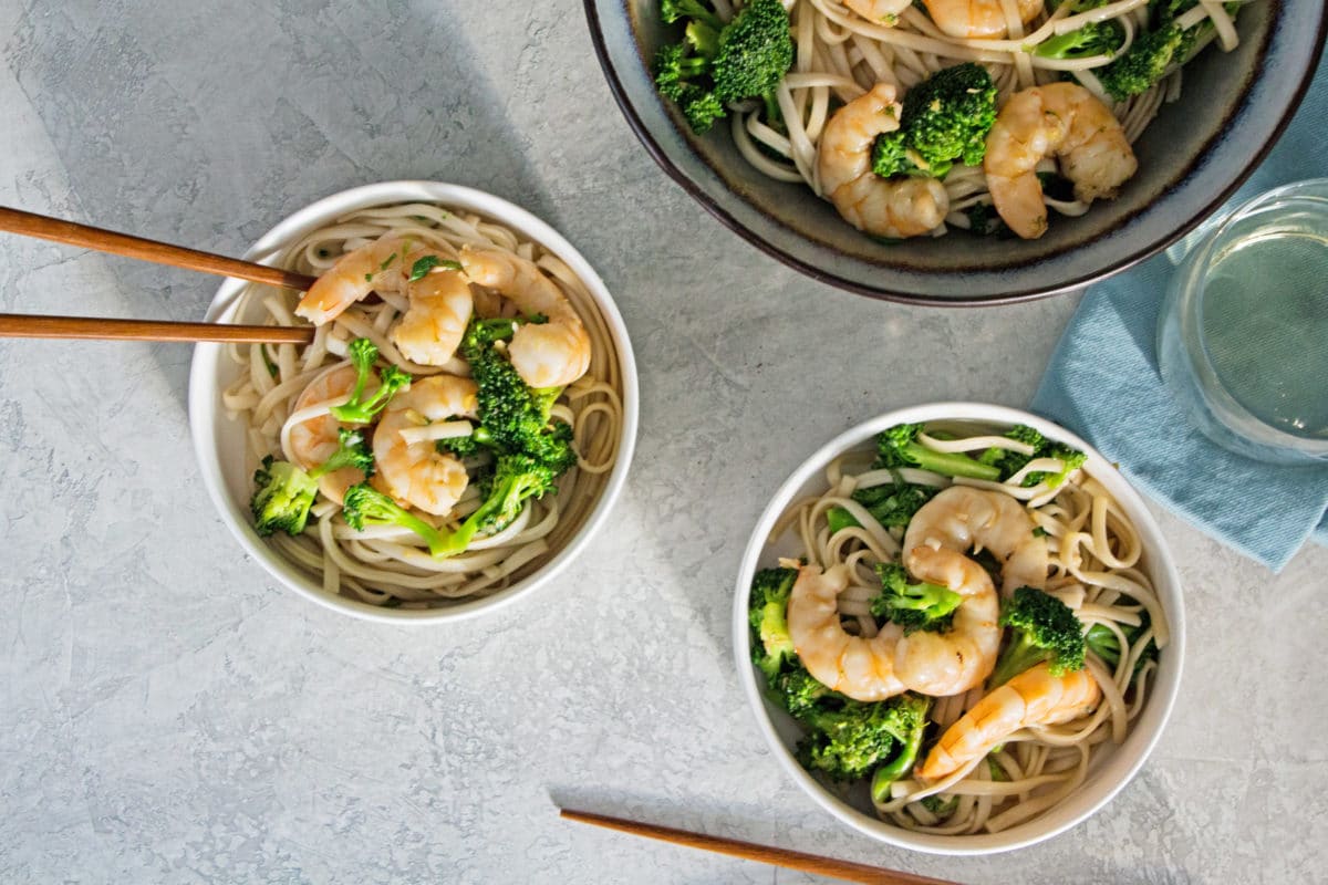 Shrimp and Broccoli Stir Fry with Udon Noodles in three bowls.