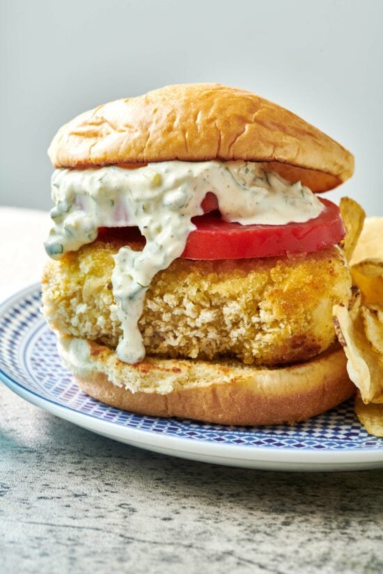 Fried Fish Sandwich dripping with tartar sauce.