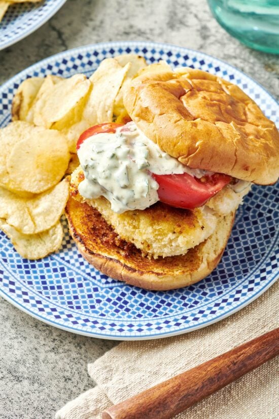 Fried Fish Sandwich on a plate with chips.