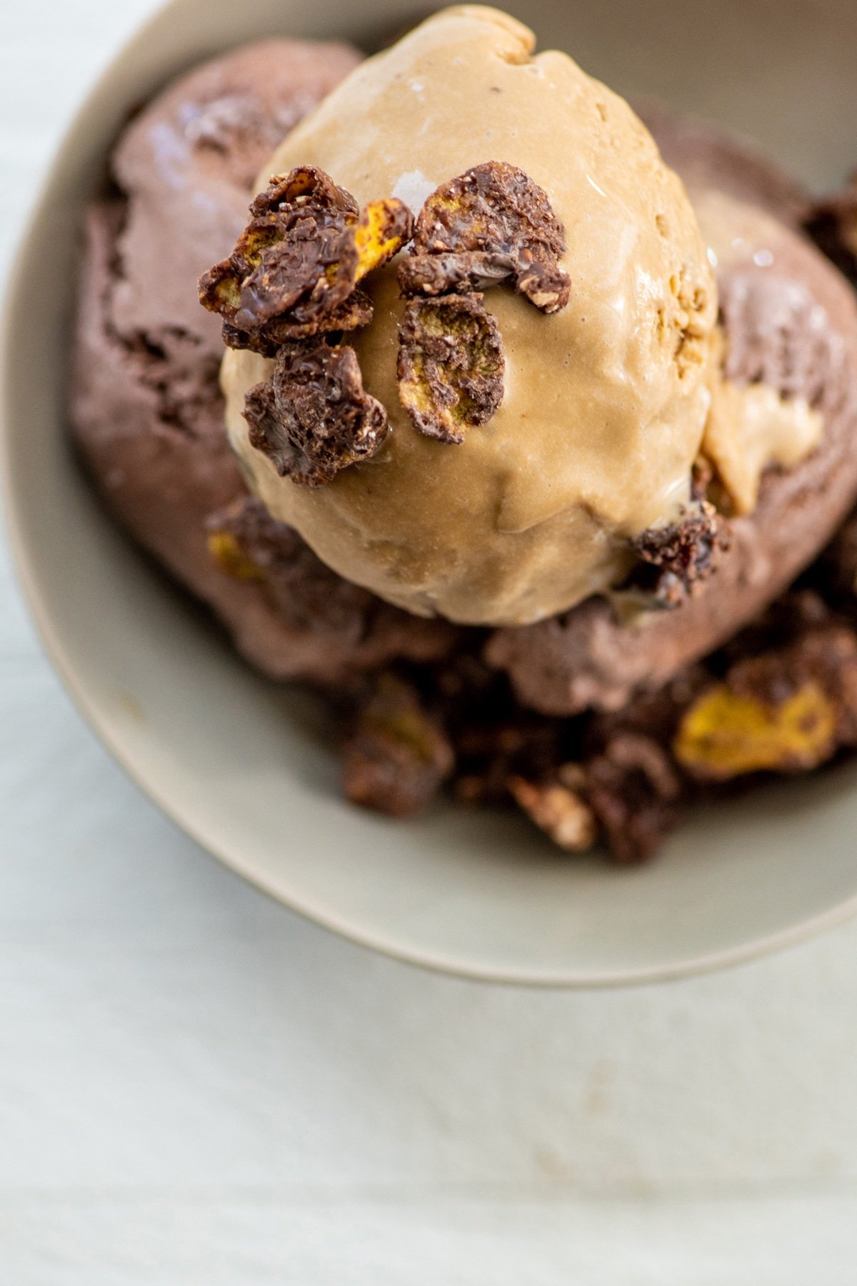 Chocolate Peanut Cornflake Crunch ice cream topping in bowl.